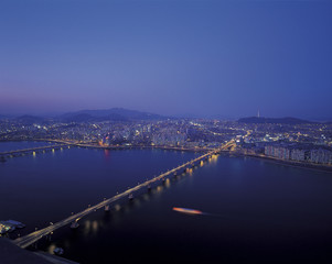 Fototapeta na wymiar night view of riverside and bridge over Han River