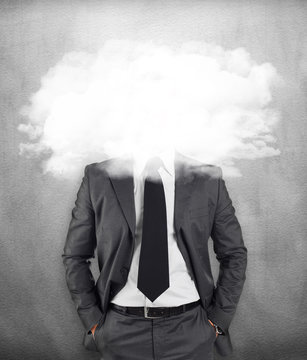 Businessman - head in the clouds