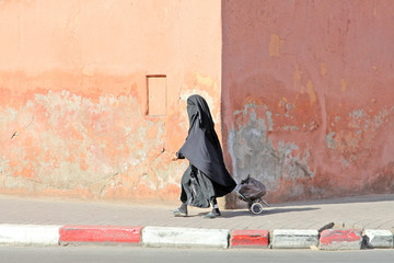 Muslim woman walking down the street