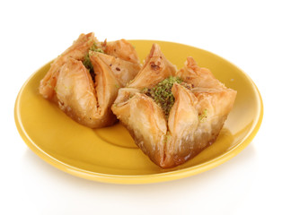 Sweet baklava on plate isolated on white