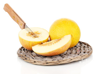 Ripe melons on wicker cradle isolated on white