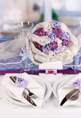 Serving fabulous wedding table in purple color of the