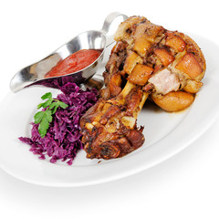 roast pork knuckle in beer with german sauerkraut and spicy sauc