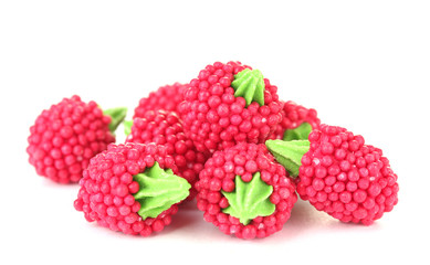 red candy raspberries isolated on white