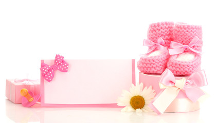 pink baby boots, pacifier, gifts, blank postcard and flower