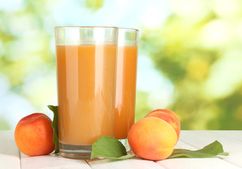 glasses of apricot juice  and fresh apricots