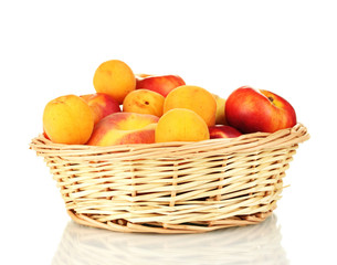 Ripe fruit in basket isolated on white