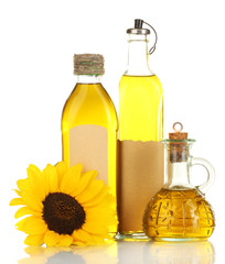 oil in jars and sunflower, isolated on white