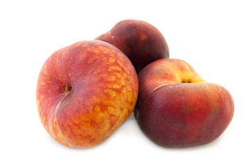 flat peaches on white background