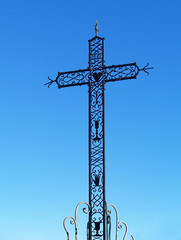 An iron cross against a blue sky, Chusclan, France