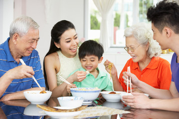 Portrait Of Multi-Generation Chinese Family Eating Meal Together