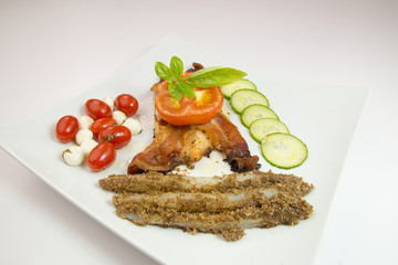 Grilled chicken with bacon, tomato and thyme on white