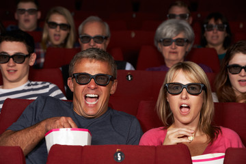 Fototapeta premium Couple Watching 3D Film In Cinema