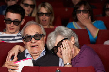 Fototapeta premium Senior Couple Watching 3D Film In Cinema