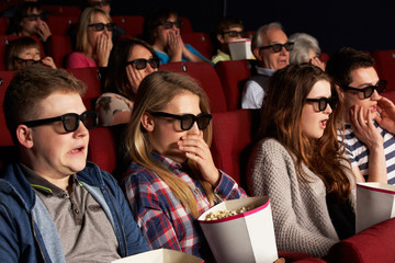 Obraz premium Group Of Teenage Friends Watching 3D Film In Cinema