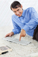Geek With Computer Keyboard And Cassette Player