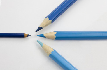 Blue pencils attacking little blue pencil