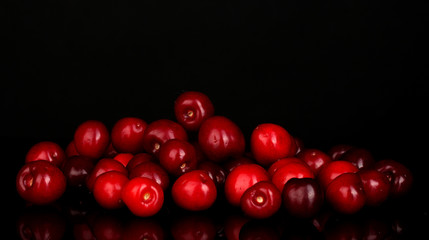 sweet cherry on black background close-up