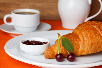 Croissant with cherry jam