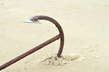 the big anchor on the sand beach