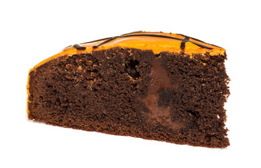 Piece of chocolate cake with icing on white isolated background
