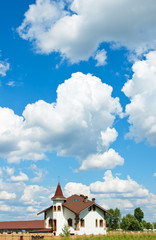 house on a background sky with clouds