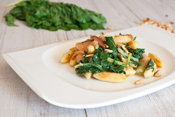 fresh salad with chard and pine nuts