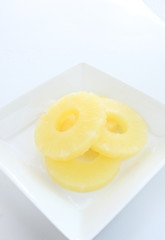 slices of pineapple for dessert image