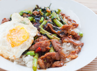stir fried pork with basil and fried egg on rice