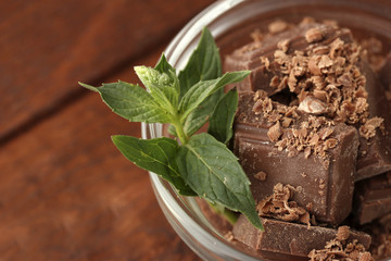 Pieces of chocolate and mint in the bowl