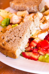 fruit-vegetable salad with bread and chicken