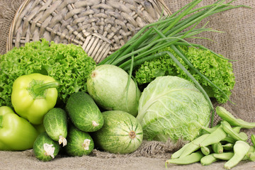 fresh green vegetables on sackcloth background