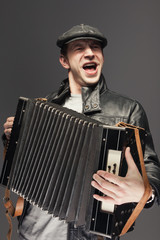 Man with accordion - obrazy, fototapety, plakaty