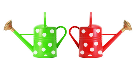 red and green polka dot watering cans isolated on white © wolfelarry