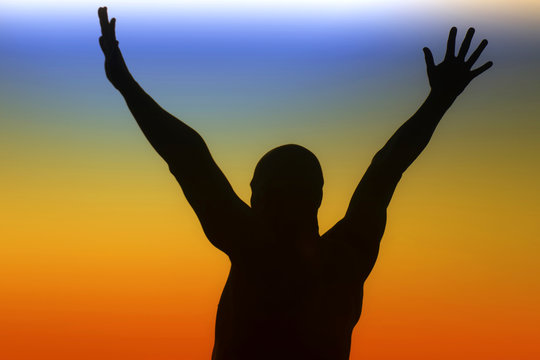 Silhouette of a man on a rainbow background