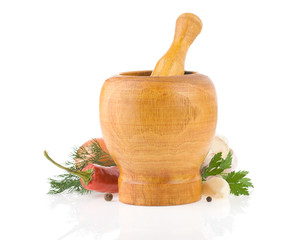 mortar with pestle and spices vegetable isolated on white