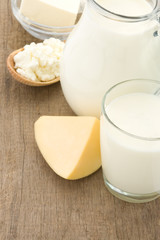 milk products and cheese on wood