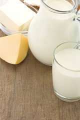 milk products and cheese on wood