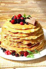 Pancakes with berries and chocolate