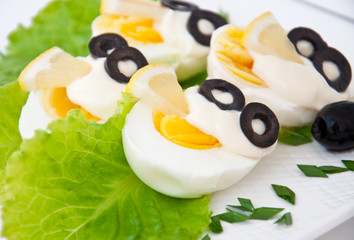 half cooked chicken eggs on a plate 