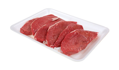 Small steaks on white meat tray