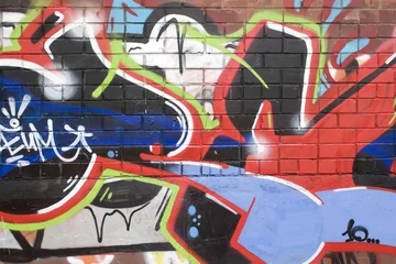 Poster Graffiti brick wall with graffiti