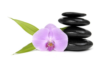 Fototapeta na wymiar Zen pebbles balance. Pink orchid and bamboo leaf