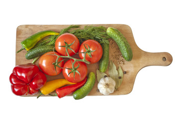 Vegetables and spices isolated on cutting board
