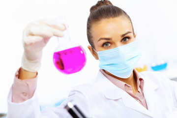 Young female scientist working in laboratory