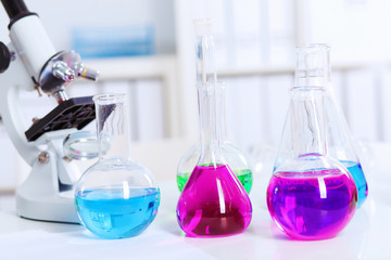 Chemistry laboratory glassware with colour liquids