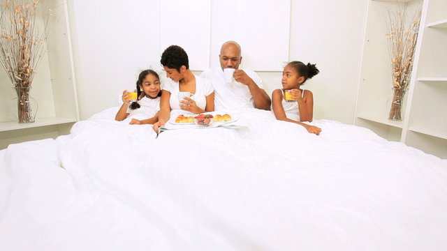 African American Parents Children Breakfast Bed