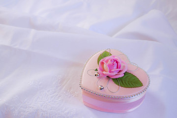 Wedding heart-shaped box with rose petals