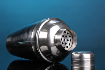 Cocktail shaker on blue background