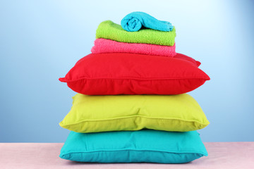 pillows and towels on red background